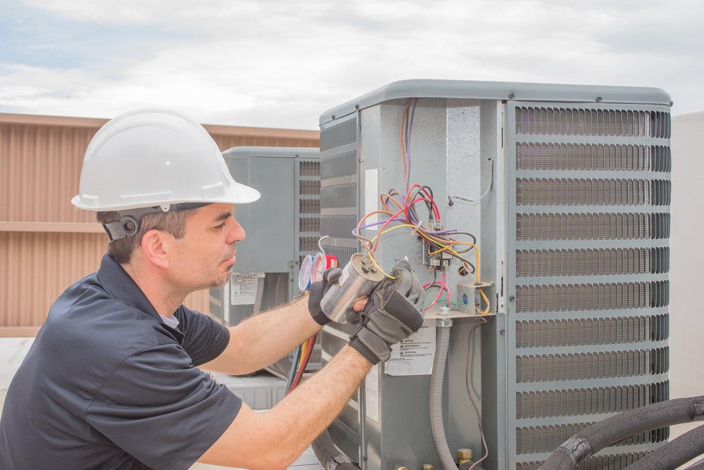 Man repairing outside unit